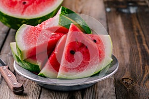 Fresh sliced watermelon on wooden rustic background