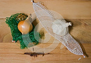 Fresh Small British Garlic & Onion Bulbs With Plastic Bag Netting From Supermarket
