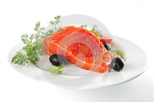 Fresh smoked salmon on white plate