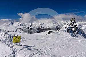 Fresh snow and danger sign at the off piste terrain at the Meribel ski area.