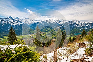 Fresh snow on mount slope on Harder Kulm - popular viewpoint over Interlaken, Swiss Alps, Switzerland