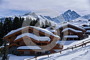 Fresh snow on the roofs of chalets in Courchevel, France.