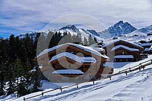 Fresh snow on the roofs of chalets in Courchevel, France.