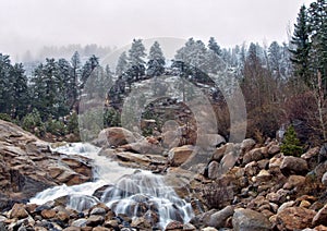 Fresh snow and waterfall in the Rocky Mountain National Park