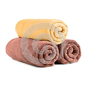 Fresh soft rolled towels on white