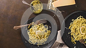 Fresh spaghetti with basil pesto and cheese