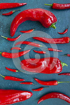 Fresh spicy chili peppers and paprika top view