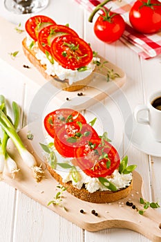 Fresh spring breakfast with toasted bread with cheese and tomatoes