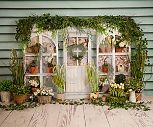 Fresh spring fatade with flowers, ivy and flower pots photo