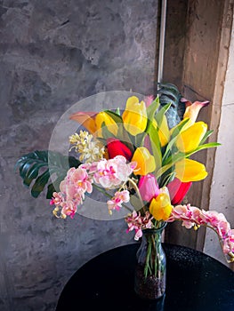 Fresh spring flowers on brick wall background
