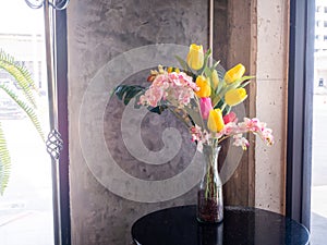 Fresh spring flowers on brick wall background