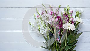 Fresh spring flowers displayed elegantly against clean white backdrop