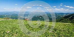 Fresh spring mountain meadow with hills on the background in Mala Fatra mountains in Slovakia