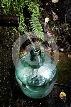 Fresh spring water in a demijohn bottle