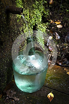 Fresh spring water in a demijohn bottle