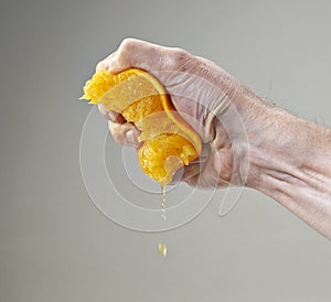 Fresh Squeezed Orange Juice by male hand