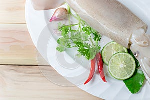Fresh squid with lemon and parsley.