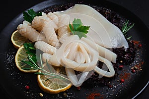 Fresh squid , raw, carcass, cut into rings, top view, no people,