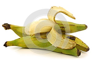 Fresh still unripe plantain (baking) bananas photo