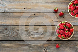 Fresh strawberries on basket top view. Healthy food on wooden table mockup. Delicious, sweet, juicy and ripe berry