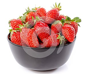 Fresh strawberries in a black cup