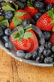 Fresh Strawberries and Blueberries in Colander