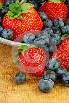 Fresh Strawberries and Blueberries in Colander