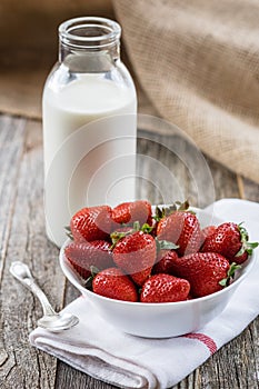 Fresh Strawberries with a Bottle of Milk