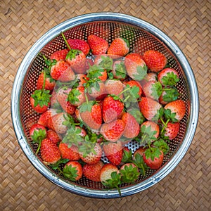 Fresh Strawberries with bright red berries in basket