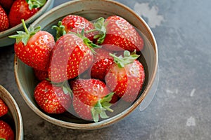 Fresh strawberries in ceramic bowl