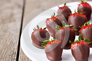 Fresh strawberries dipped in chocolate sauce