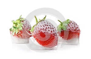 Fresh strawberries frozen in ice cubes