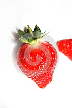 Fresh strawberries isolated on the white plate.