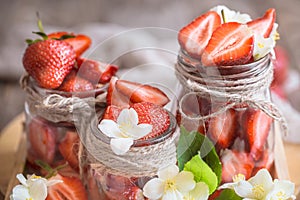 Fresh strawberries in jars