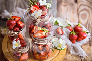 Fresh strawberries in jars