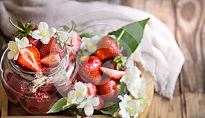 Fresh strawberries in jars