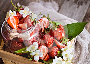 Fresh strawberries in jars