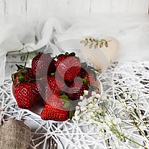 fresh strawberries on a natural wooden background