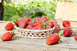 Fresh strawberries on old wooden background