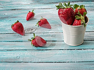 Fresh strawberries on an old wooden surface