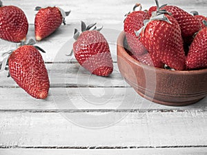 Fresh strawberries on an old wooden surface