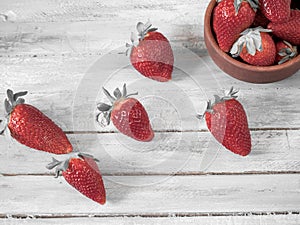 Fresh strawberries on an old wooden surface