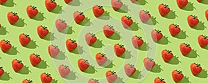 Fresh strawberries in a pattern on the green pastel background. Top view. Continous pattern, isolate, flat lay, hard light,