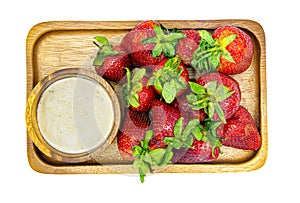 Fresh strawberries placed in a wooden plate and salad dressing cup isolated on white background,Object have clipping path.Healthy