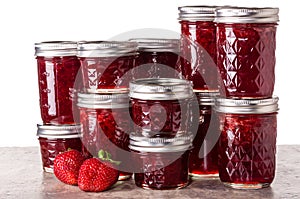 Fresh strawberries preserved in jars