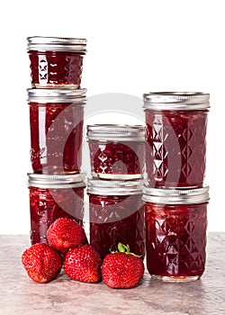 Fresh strawberries preserved in jars