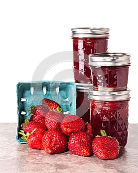 Fresh strawberries preserved in jars