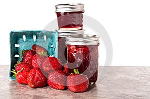 Fresh strawberries preserved in jars