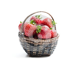 Fresh strawberries in small basket isolated on white