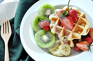 Fresh Strawberries and Variety Fruits Top on Waffle Dish